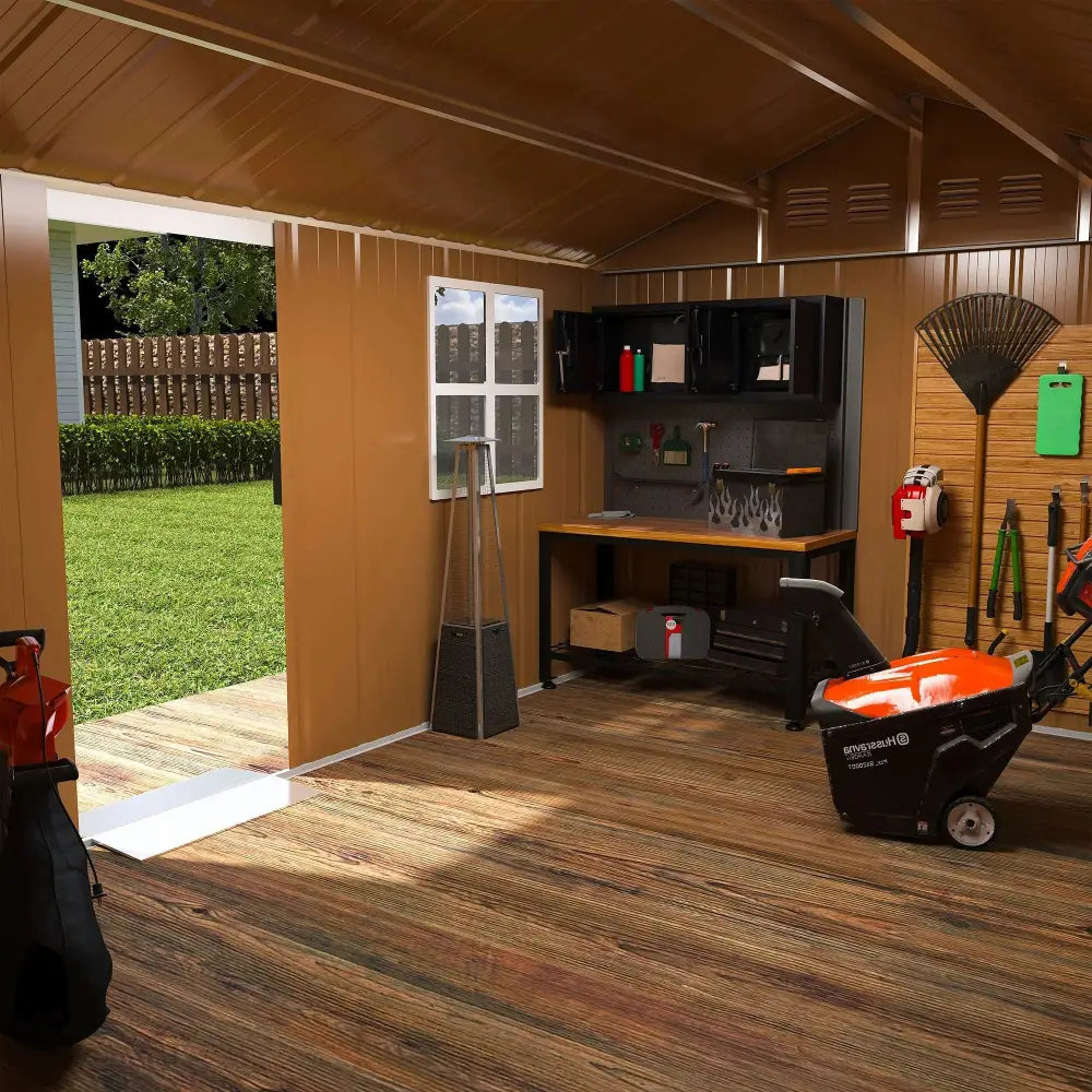Black and orange heavy duty 12x8 ft metal storage shed with windows storing a snow blower with wheels
