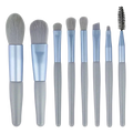 Set of eight sleek light blue and gray makeup brushes with soft bristles in a professional 13 piece makeup brush set