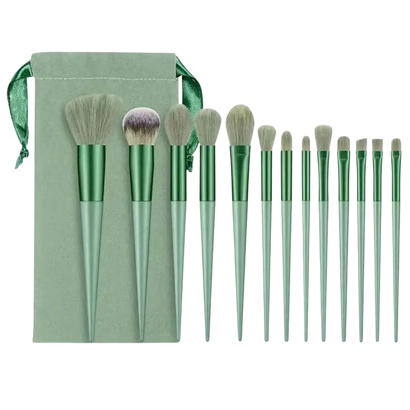 Set of 15 green professional makeup brushes with metallic handles and soft bristles next to a sage-green velvet pouch