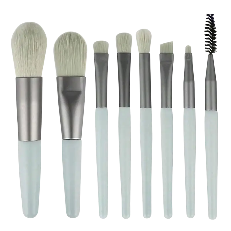 Set of eight professional makeup brushes with soft white bristles and translucent light blue handles from a 13-piece set