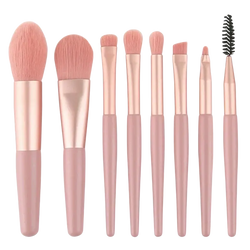 Set of seven rose gold and blush pink makeup brushes with soft bristles from 13 piece professional makeup brush set