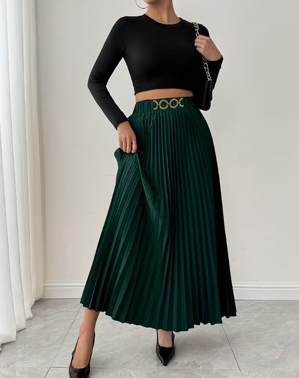 Emerald green pleated midi skirt with a high-waisted a-line silhouette and a gold-toned belt buckle with an ornate symmetrical design.