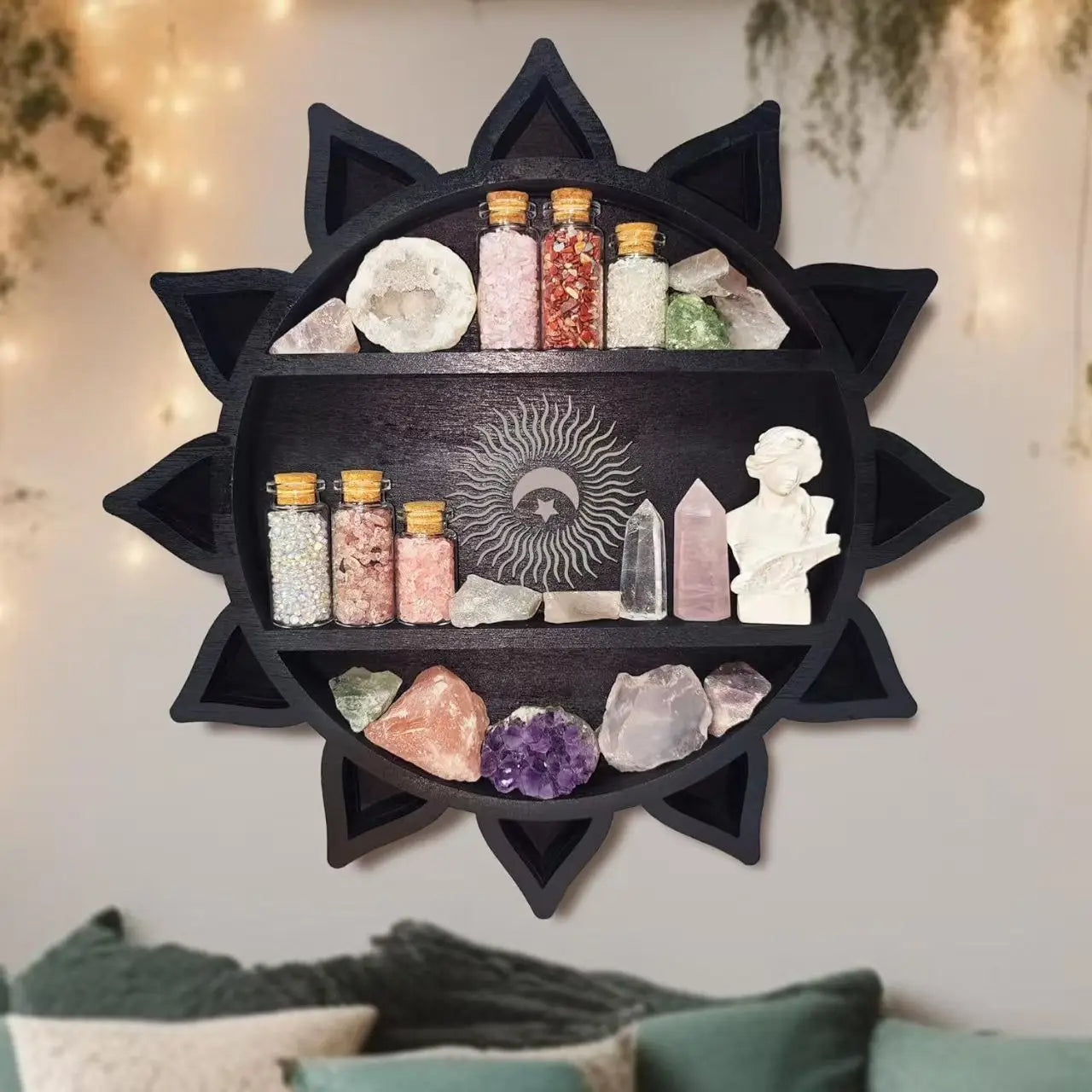 Black sun-shaped wooden floating shelf with three tiers displaying crystals minerals and glass jars in a crystal display rack.
