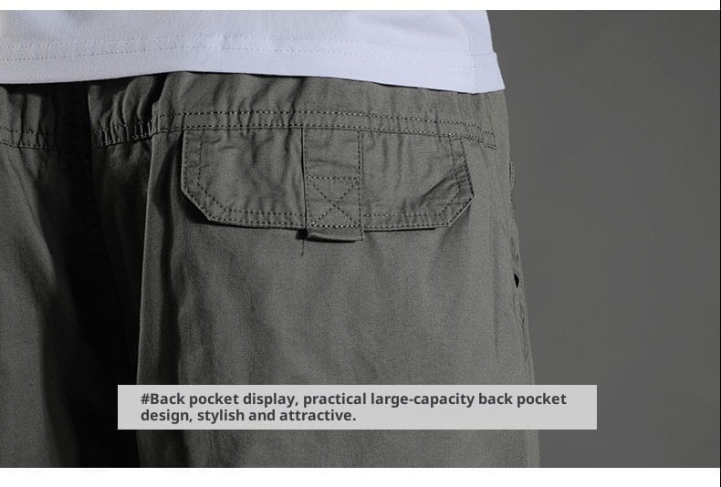 mens japanese style cotton straight leg workwear pants in olive green showing back side with a large cargo pocket featuring reinforced stitching and subtle cross stitch detail