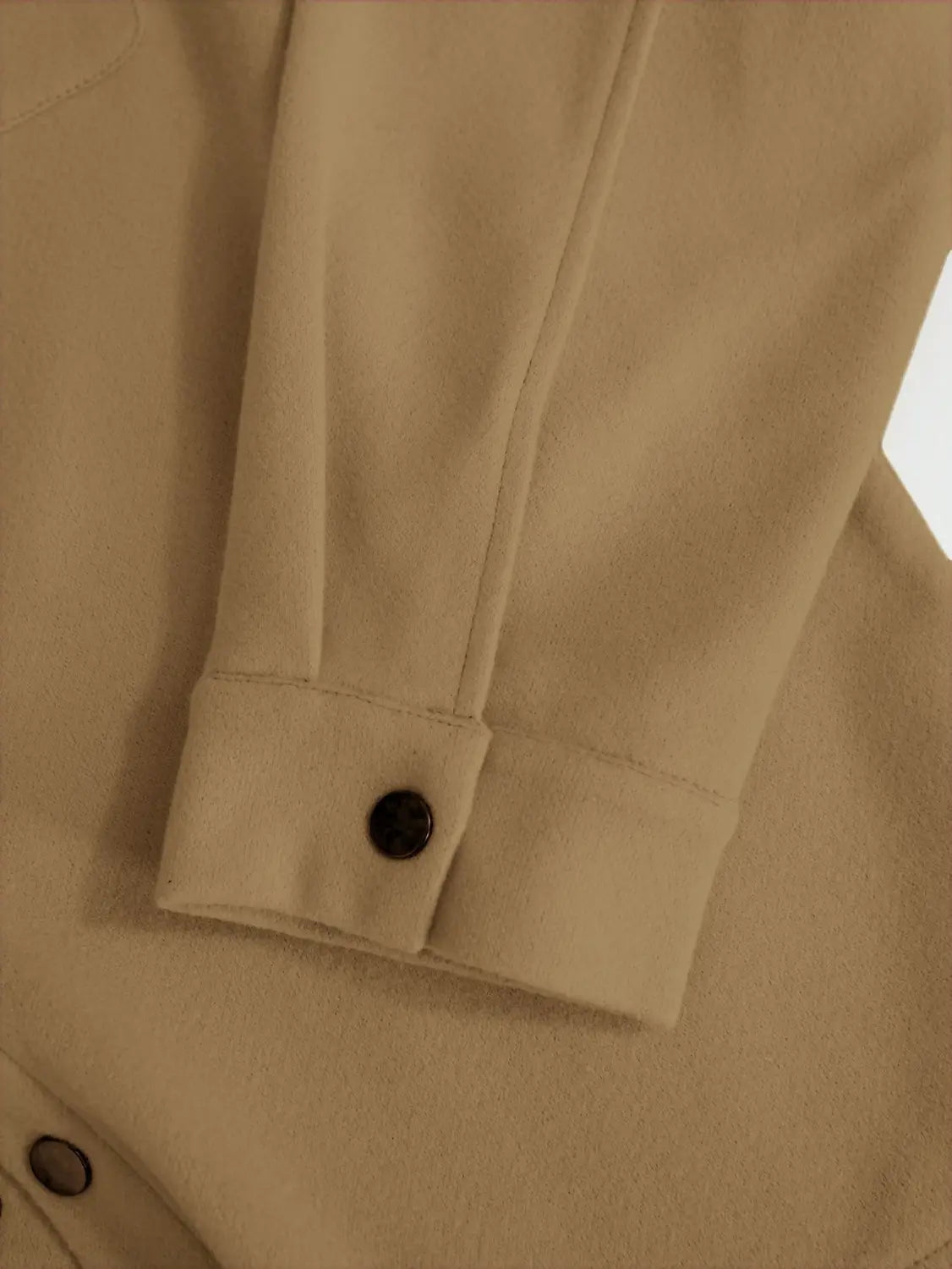 Beige woolen coat sleeve with a black button at the cuff of the men’s classic slim fit wool blend lapel jacket.