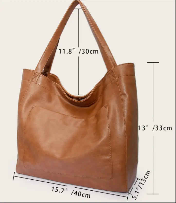 Brown oil wax leather tote shoulder bag with a large capacity, spacious slouchy design, and two sturdy handles.