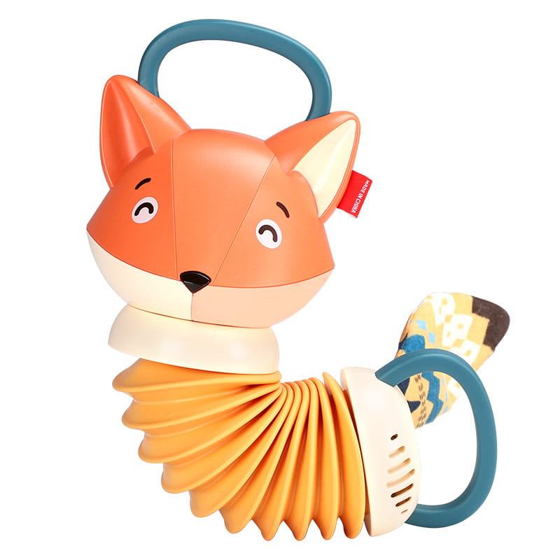 Un jouet musical d’accordéon pour bébé en forme de renard orange, à corps d’accordéon flexible, poignées turquoise et queue à motifs.