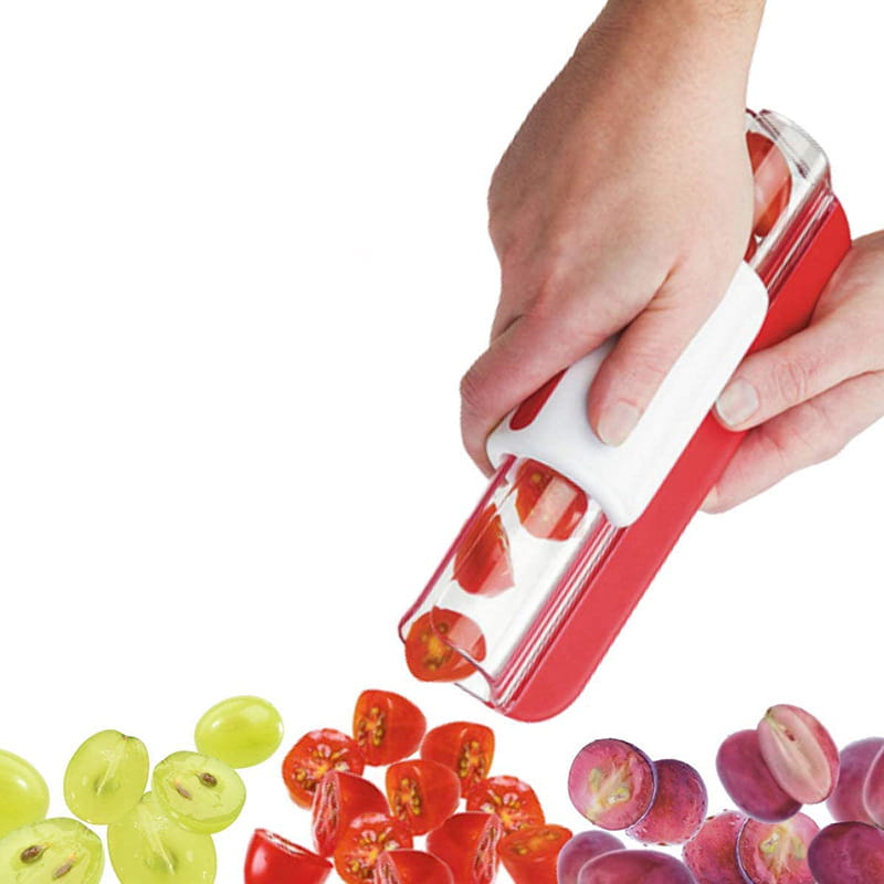 Trancheuse à fruits pour raisin et tomate, en rouge et blanc, avec une chambre en plastique transparente pour une découpe facile dans la cuisine.