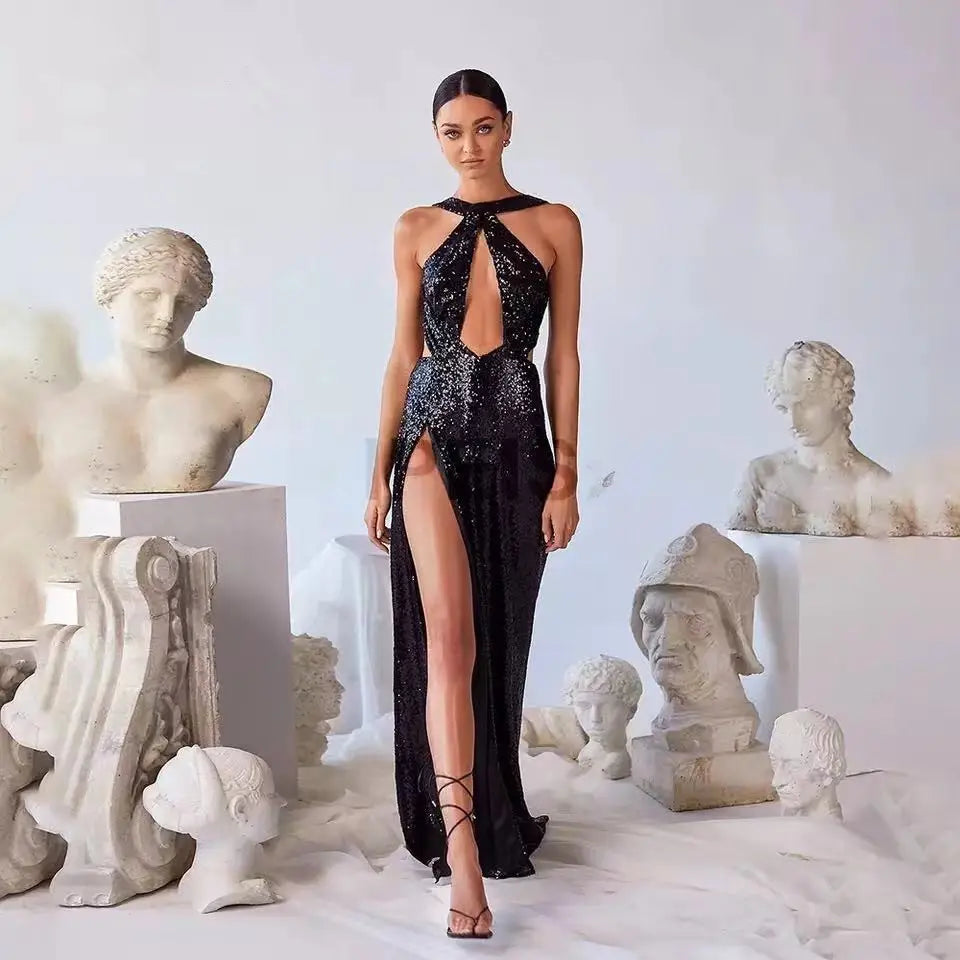 black sequined halter neck evening gown with a high slit paired with black lace-up heels for formal occasions