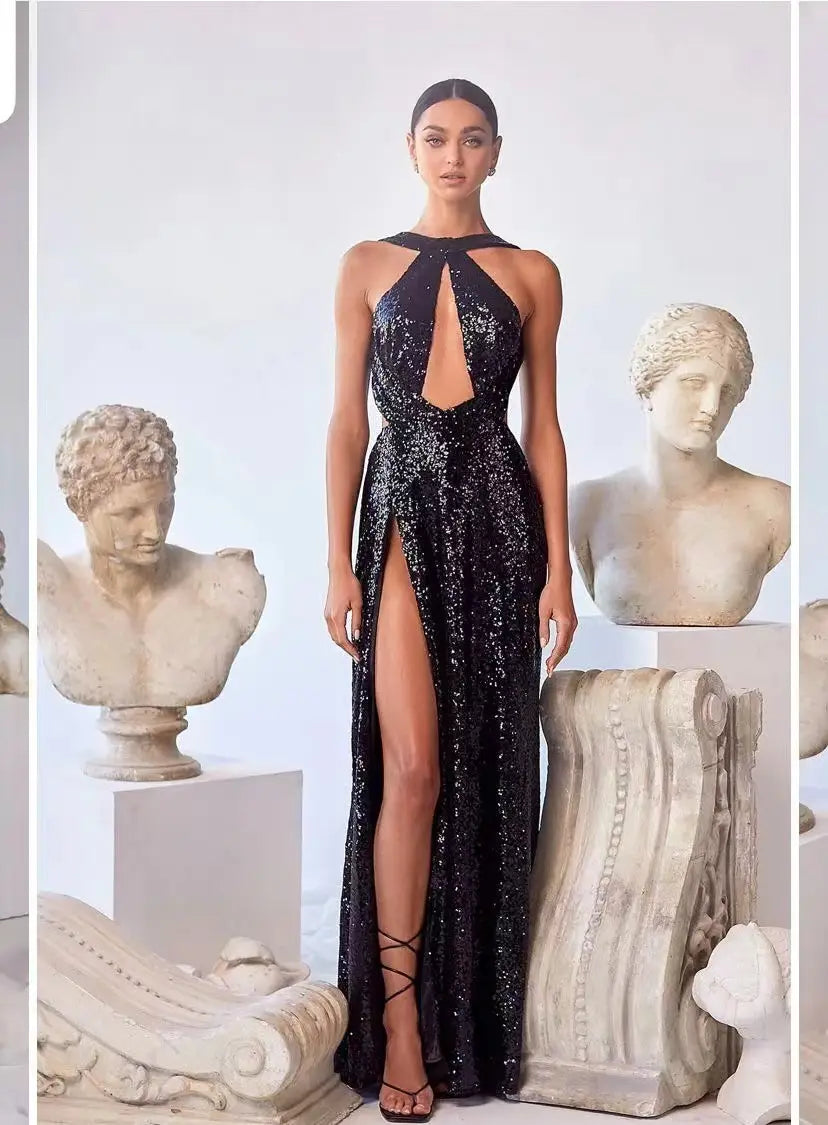 A shimmering black sequined halter neck evening gown with a high slit designed for formal events.