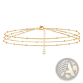 14k gold filled triple layer beaded chain bracelet with gold-toned strands, small beads, and teardrop crystal pendant