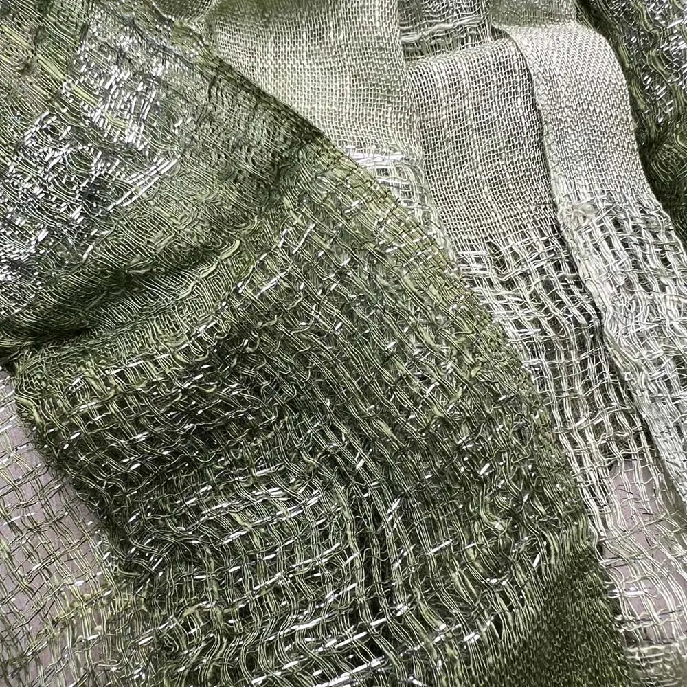 an olive green metallic shimmer scarf made of shimmering olive green metallic mesh fabric with a textured woven pattern
