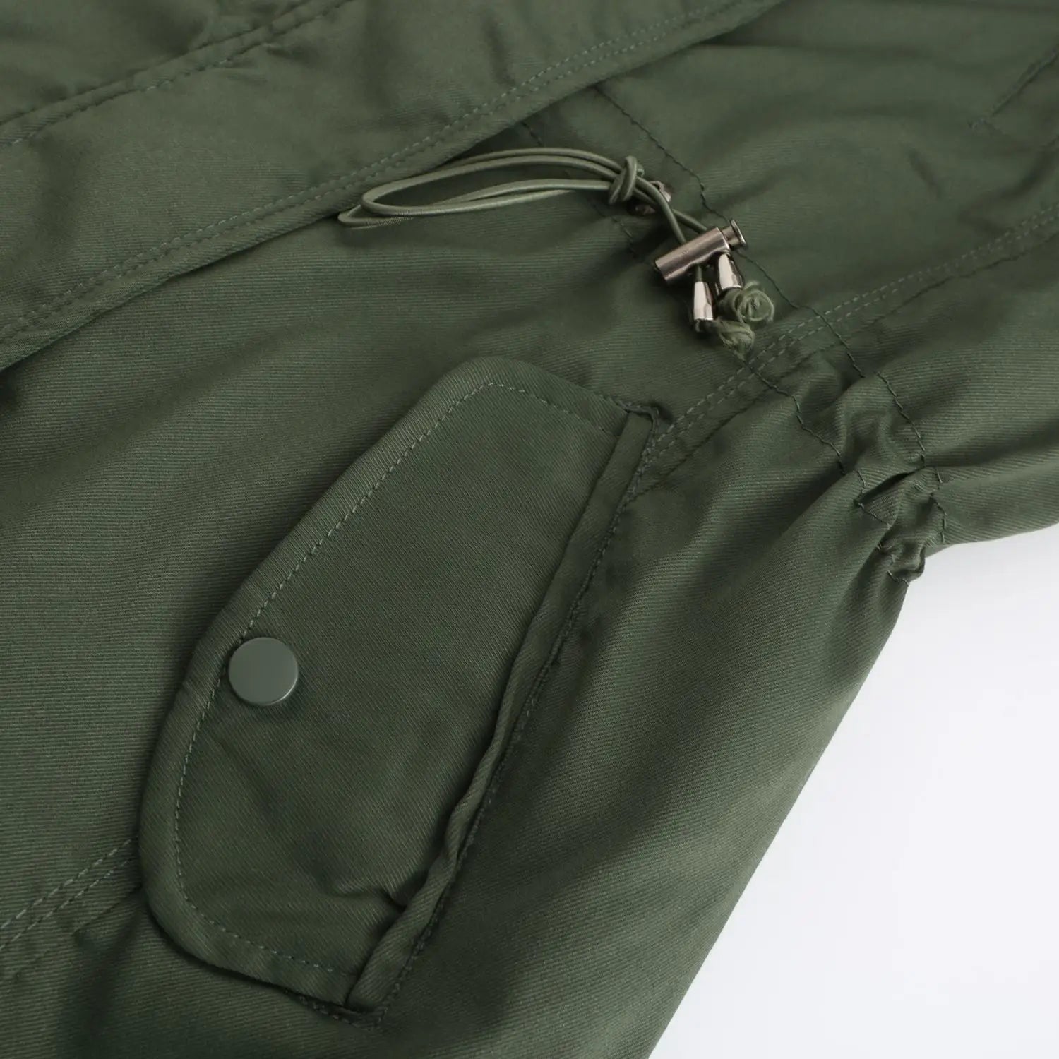 Olive green nylon reversible fur collar quilted parka featuring a flap pocket and drawstring closure.