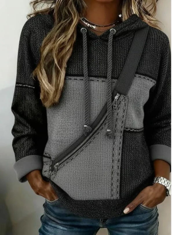 A women 3d patchwork hoodie in two-tone gray with textured knit fabric featuring contrasting panels and a diagonal zipper pocket.