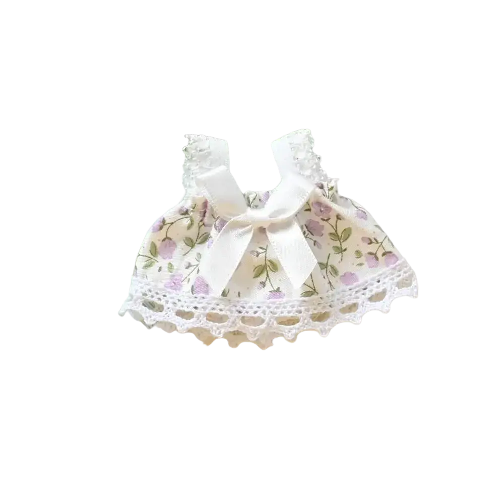 A 15cm doll gingham dress featuring a delicate white lace trim floral pattern with a satin bow neckline