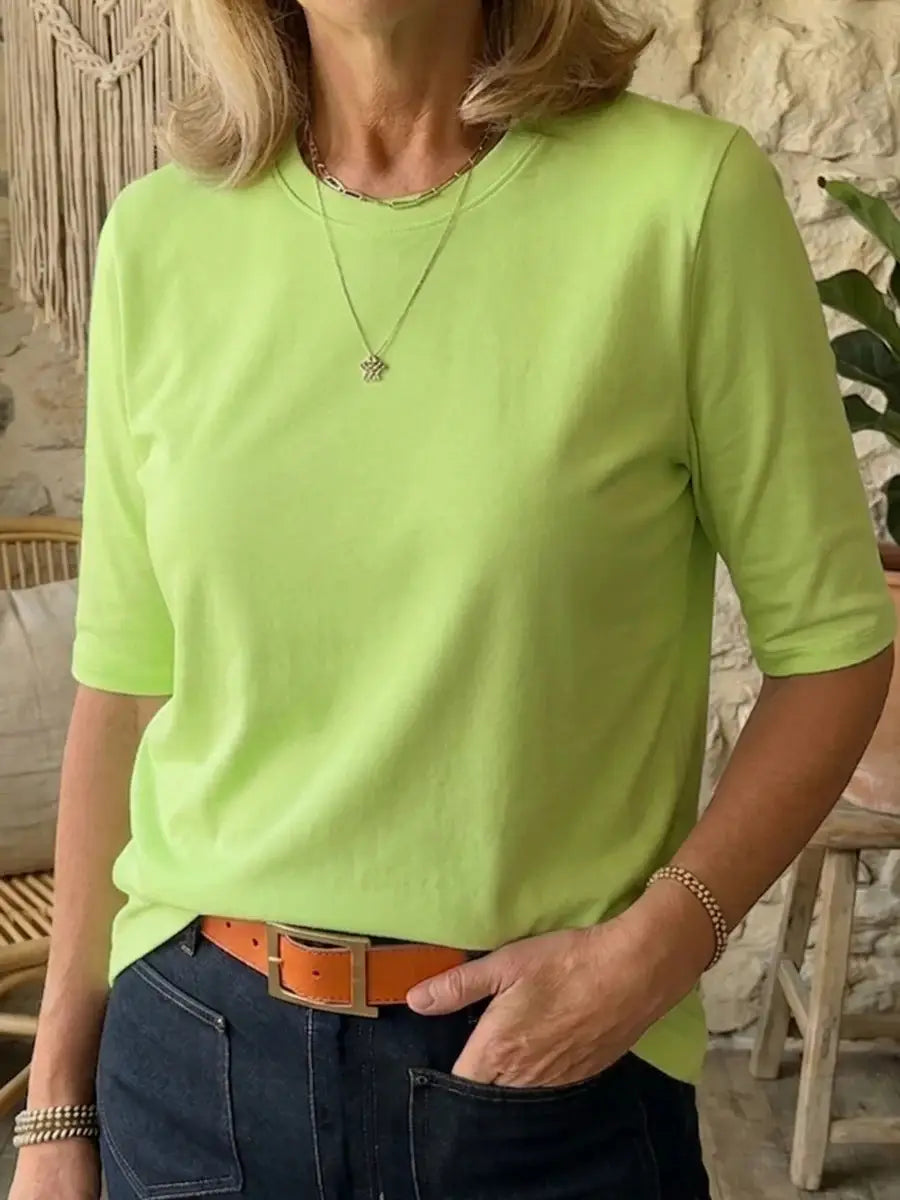 Ein weiches Casual-Pullover-Oberteil mit Rundhalsausschnitt in Neon-Limettengrün, mit kurzen Ärmeln und lockerer Passform.