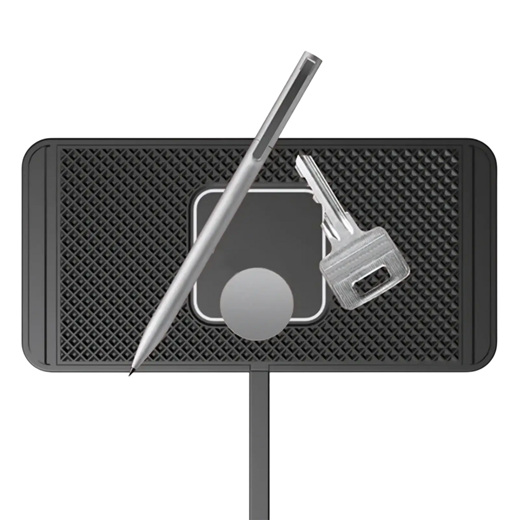 Black textured magnetic 15w fast wireless car charger pad with sleek silver stylus and key on its surface