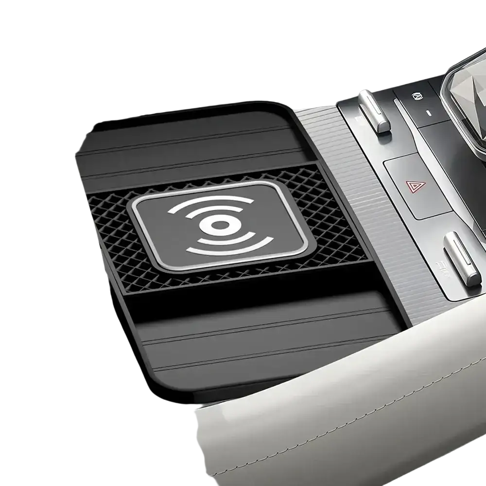 Black 15w fast wireless car charging pad with textured surface and silver emblem featuring concentric arcs