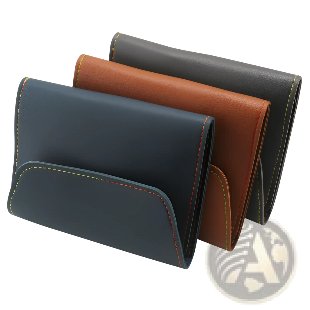 Three slim rectangular leather wallets in navy blue brown and black with contrasting stitching for professional manicure kit