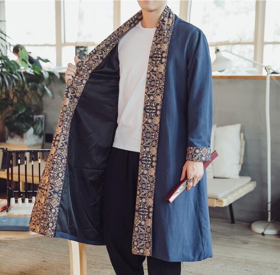 Plus size dragon embroidered mens long coat in blue with intricate gold and brown patterned trim along the edges.
