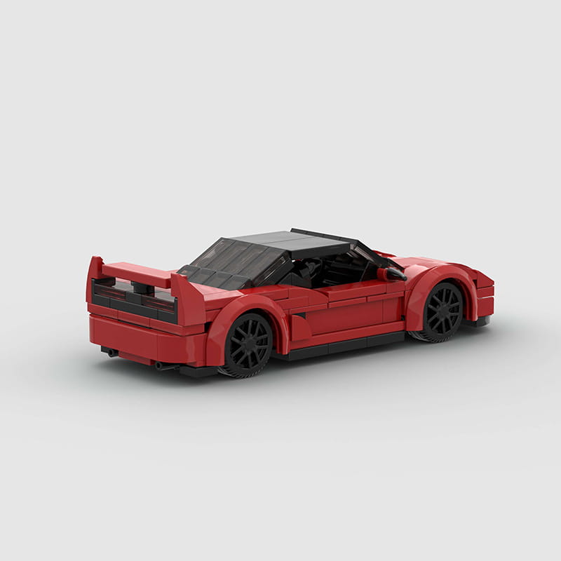 Roter Lego-Technic-Sportwagen-Baukasten als Spielzeug, mit einem detaillierten roten Modell mit schwarzen Rädern und Dach.