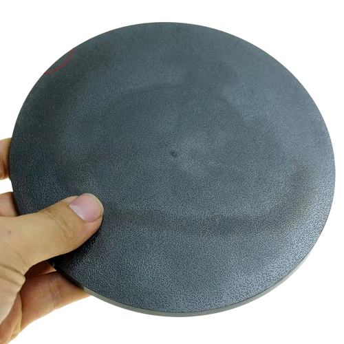 A dark gray 160mm round miniature base foam sanding pad with a textured surface for detailed sanding tasks