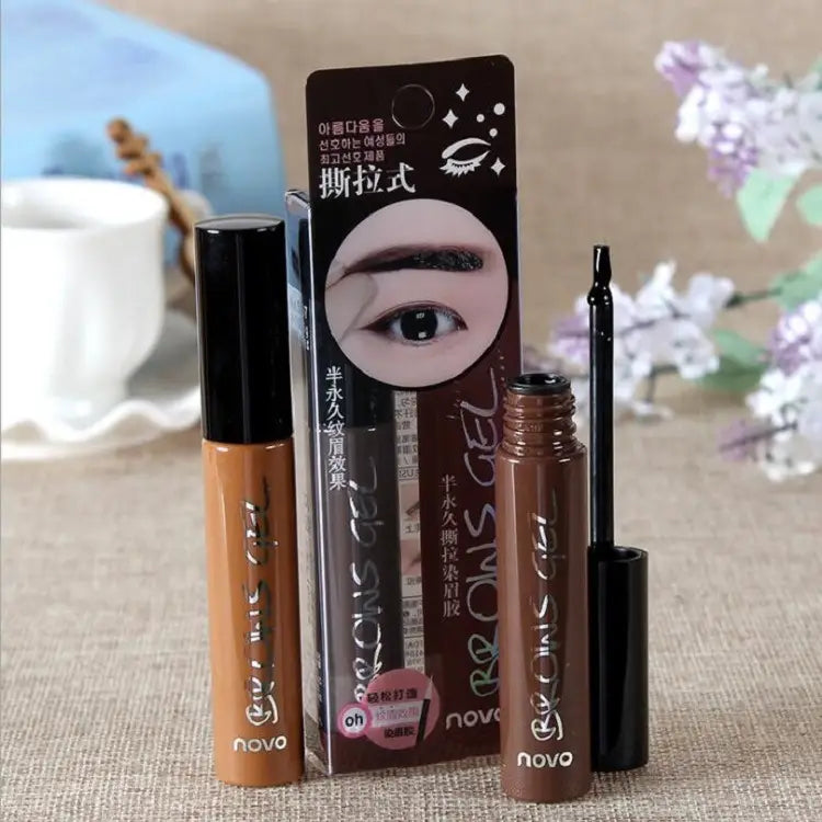 brown liquid eyebrow gel in a sleek cylindrical tube with black cap and applicator from peel off eyebrow tattoo tint waterproof gel kit for long-lasting makeup.