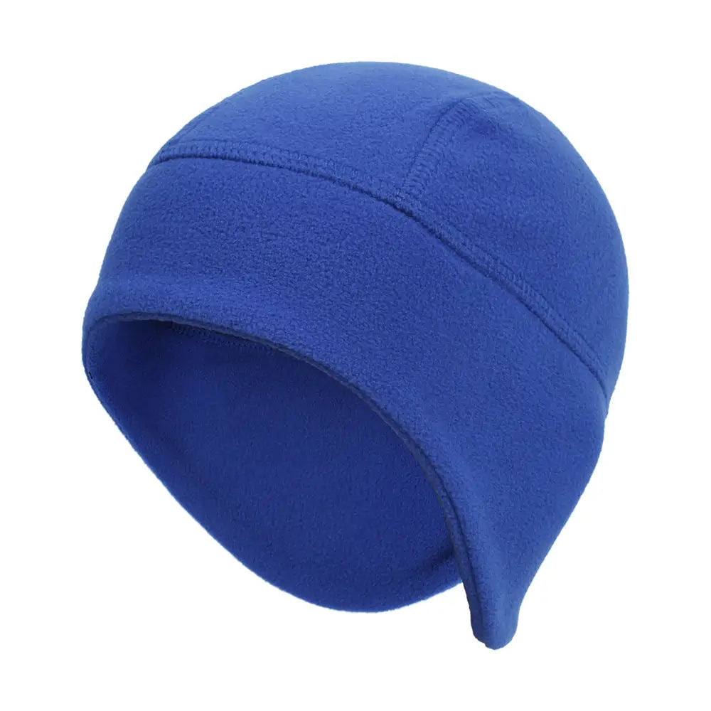Thermal fleece beanie hat in solid royal blue featuring a soft plush texture and subtle stitched seams designed for windproof winter sports headwear.