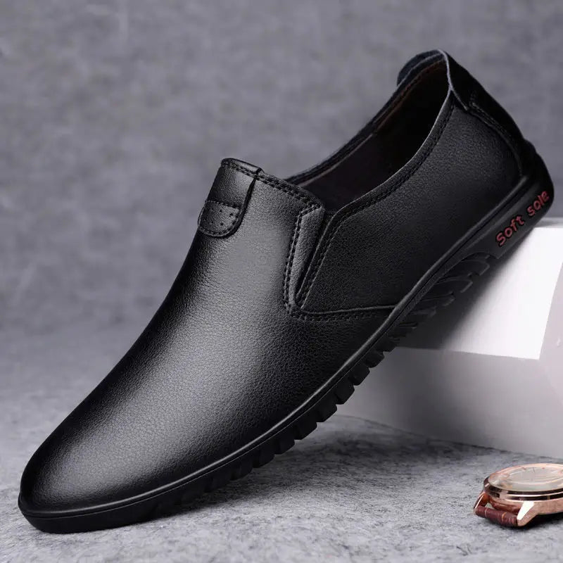mens black korean style breathable leather hiking shoe back view with textured sole and subtle red branding on heel
