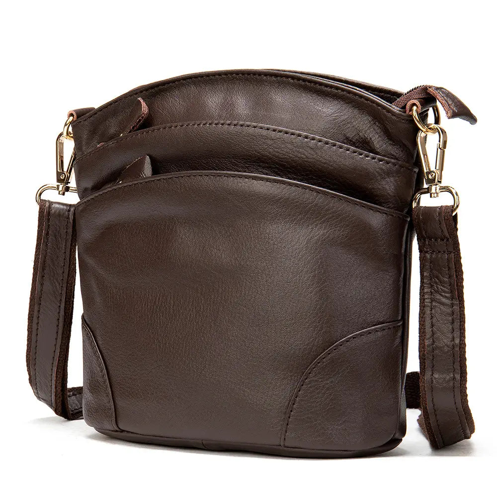Brown leather crossbody bag with textured surface and gold-tone hardware designed as a retro cowhide shoulder purse.