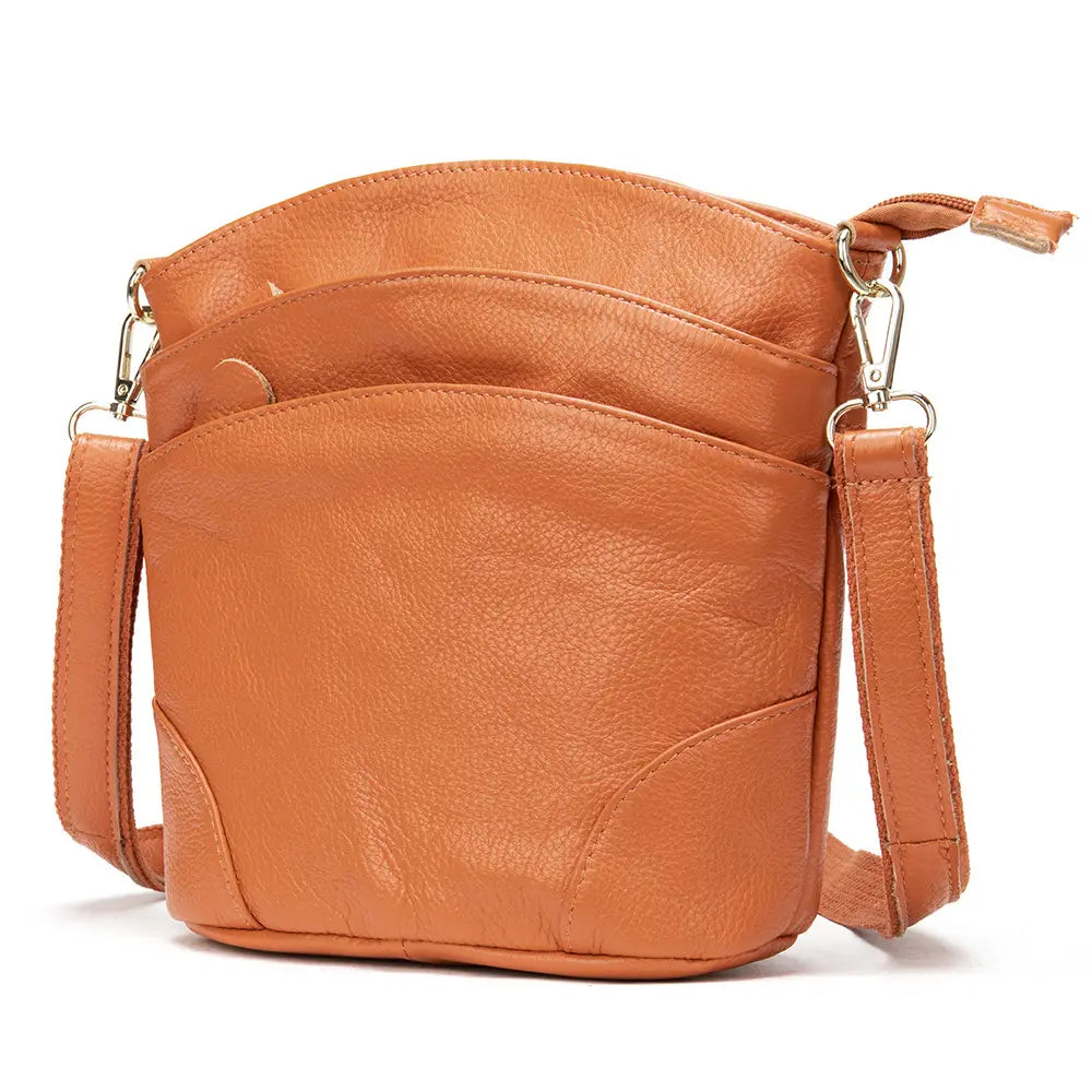 Tan leather crossbody bag made of retro cowhide with a single shoulder strap and front zipper pocket.