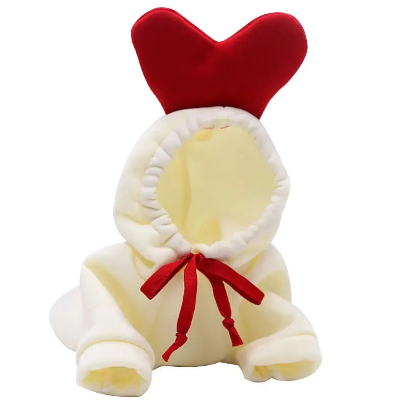 Cream-colored plush bunny pet hoodie with red velvet heart-shaped hood and matching red ribbon tie for winter clothes.