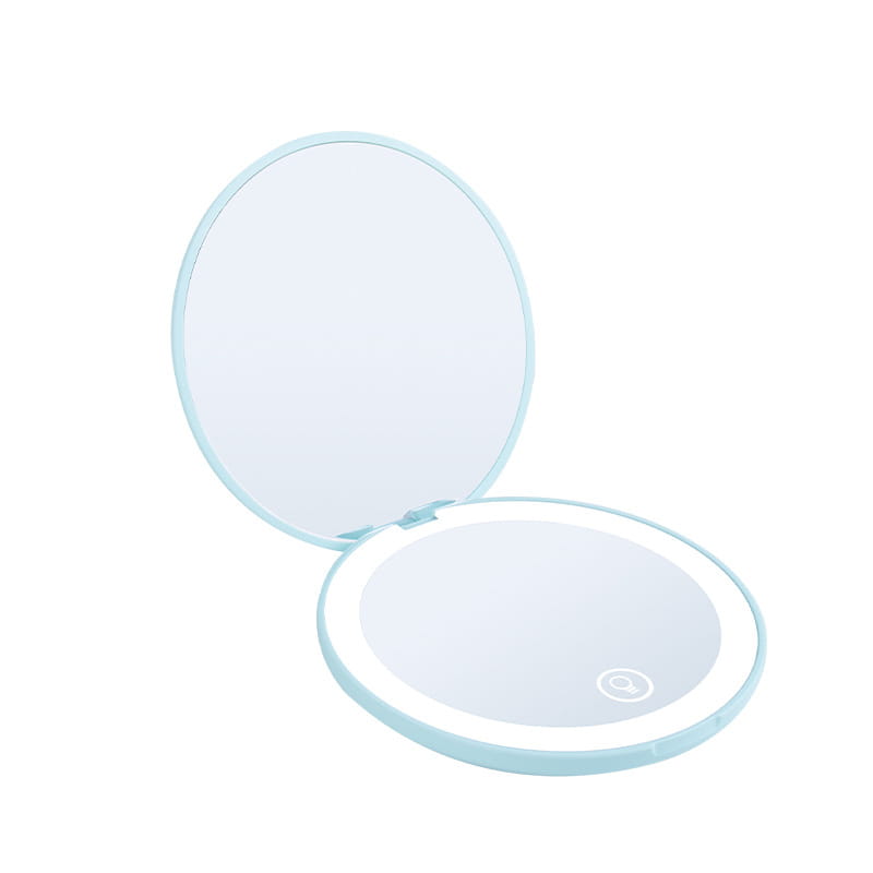 Light blue circular compact led makeup mirror with 10x magnification, led ring light, and a small button on the underside shown from the back side.