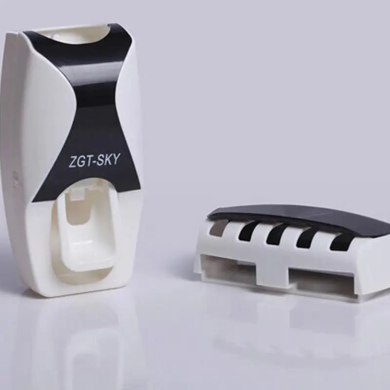 White and black zgt-sky automatic toothpaste dispenser and toothbrush holder set with a sleek modern design.