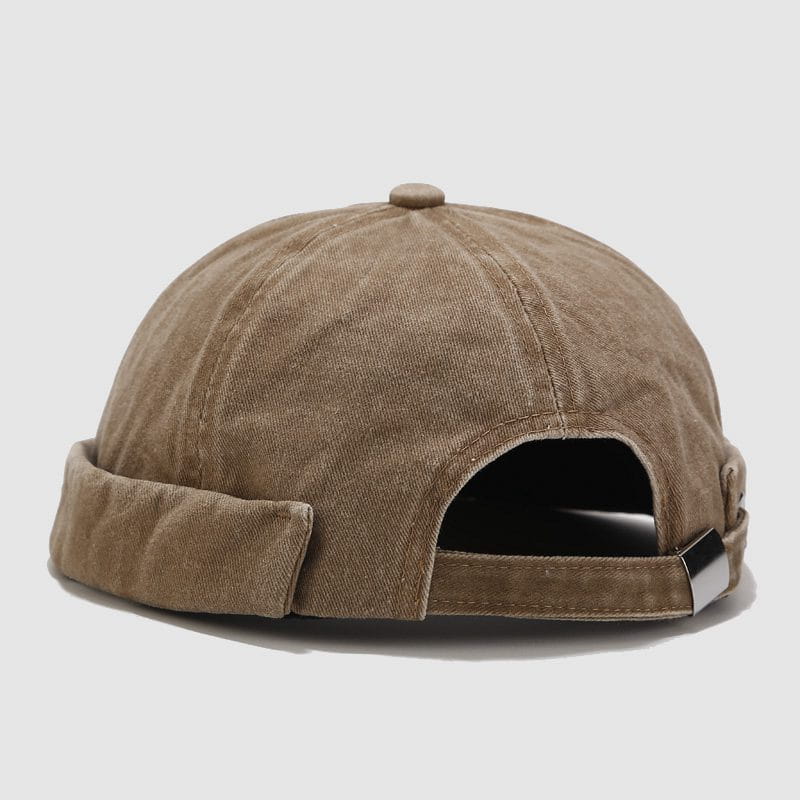 tan corduroy baseball cap with a retro rolled brim and adjustable strap shown from the back side