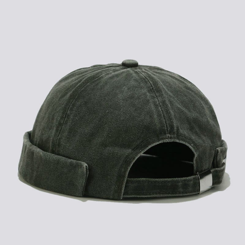 Dark green washed denim baseball cap with a retro rolled-up brim and adjustable strap.