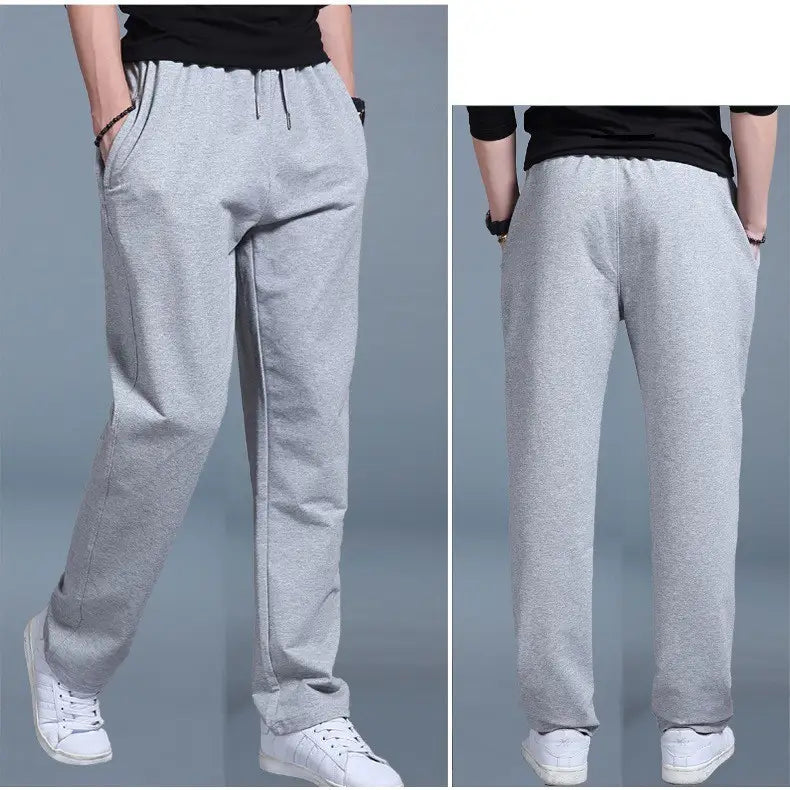 Gray heathered men breathable quick dry mesh joggers with a drawstring waistband and side pockets.