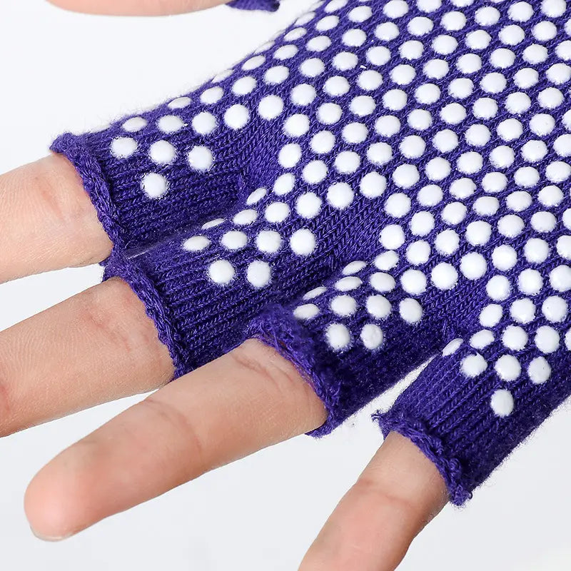 Purple knitted fingerless non-slip yoga gloves for women with white circular grip dots designed for fitness and weightlifting.