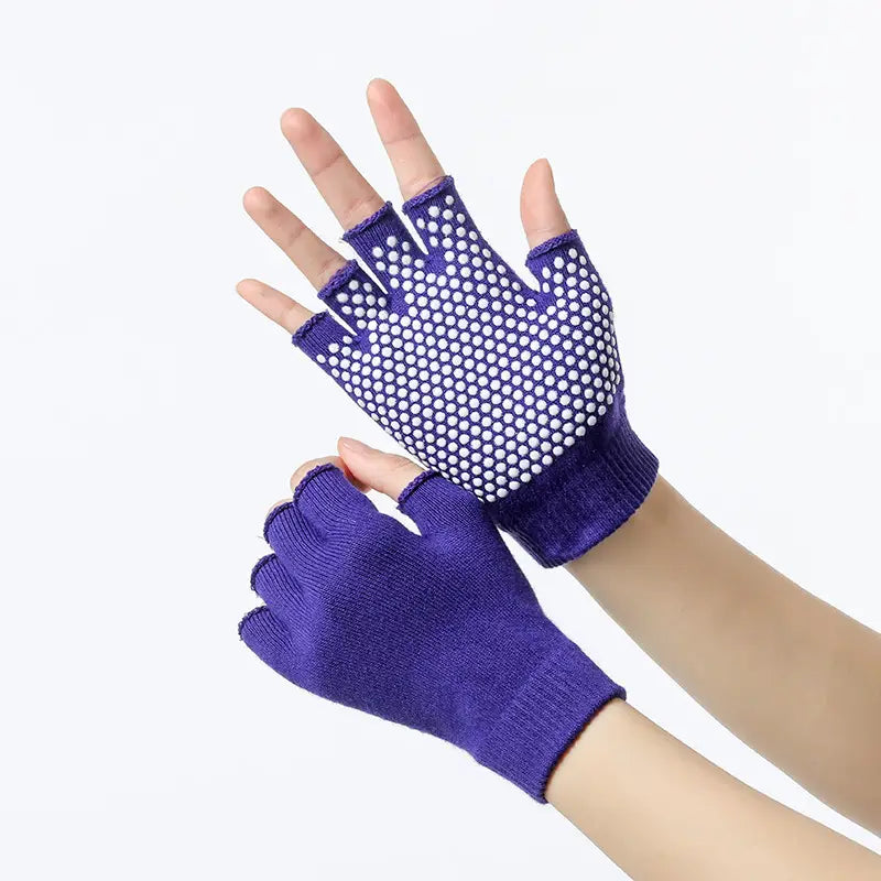 Purple non-slip yoga fingerless gloves for women with white grip dots on the palms designed for fitness and weightlifting.