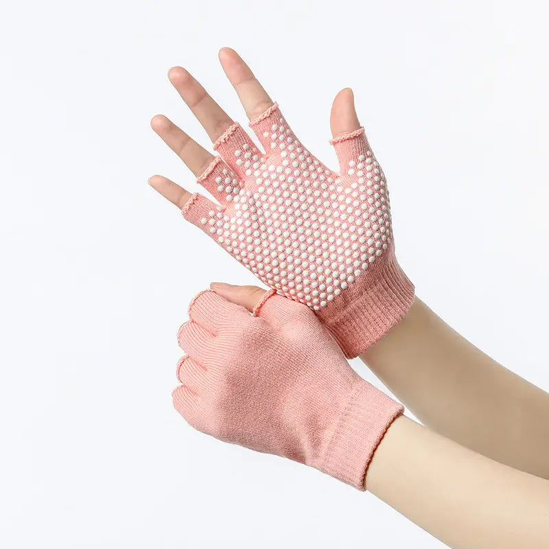 pink knitted fingerless non-slip yoga gloves for women with white grip dots on the palms designed for fitness and weightlifting
