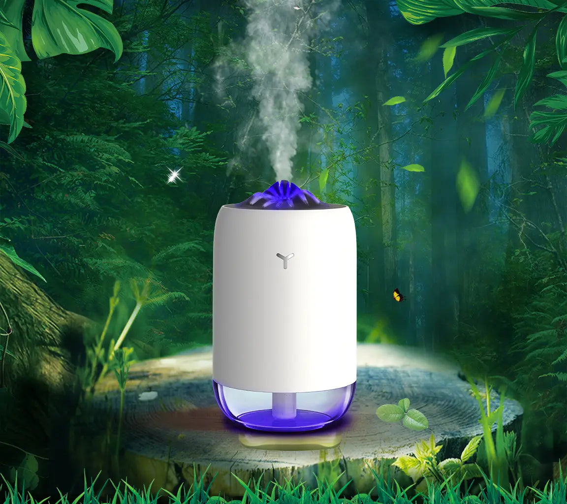 White and purple cylindrical Magic Flame humidifier mini USB ultrasonic aroma diffuser with glowing blue flower-shaped diffuser on top.