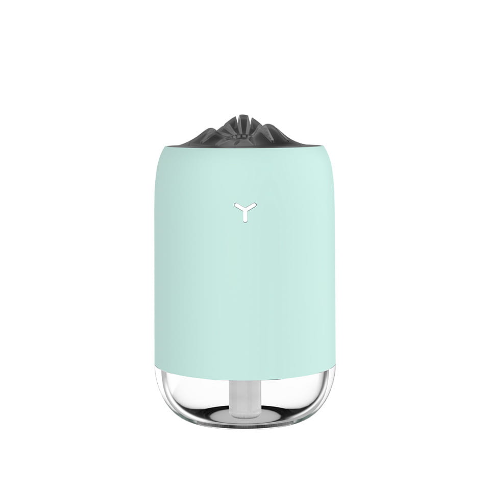 Mint green cylindrical magic flame humidifier mini USB ultrasonic aroma diffuser with a clear glass base and black fabric top.