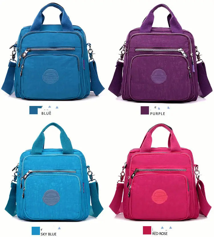 Magenta multi-functional nylon crossbody bag 25cm featuring a compact design with multiple pockets in vibrant blue purple sky blue and red rose colors.