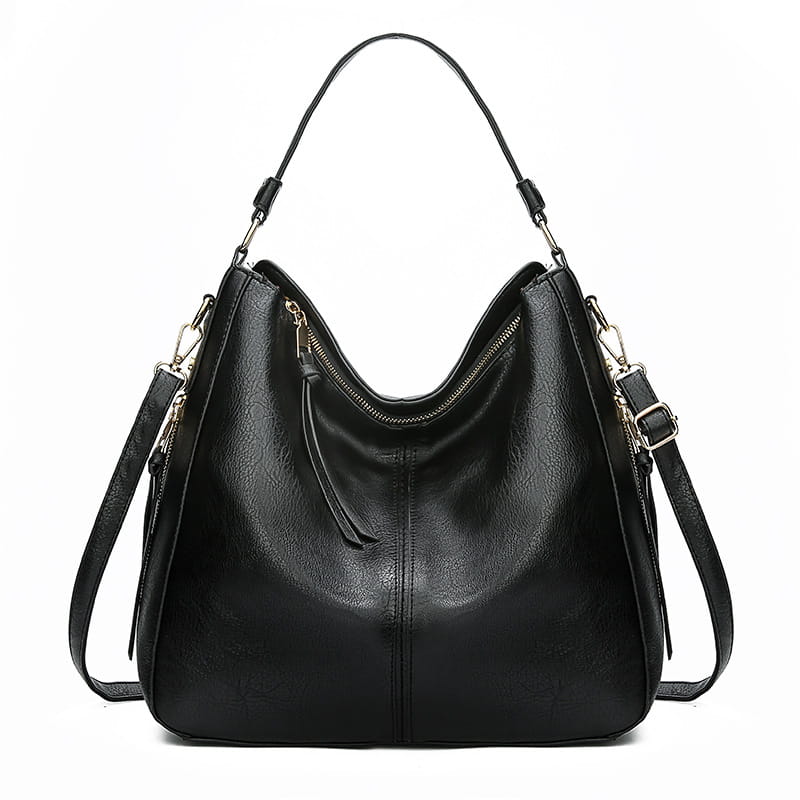 Black leather large capacity faux leather zippered hobo shoulder bag with gold-tone zippers and detachable shoulder strap.