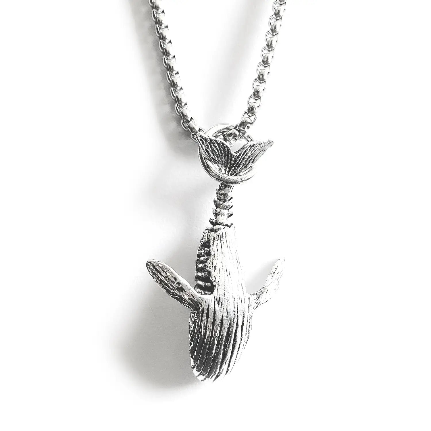 Textured silver whale pendant necklace with detailed textured surface and chain made of hip hop titanium steel.