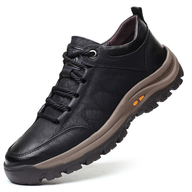 Men’s leather hiking shoes in black with a rugged sole and orange accent details designed for vintage casual outdoor use.