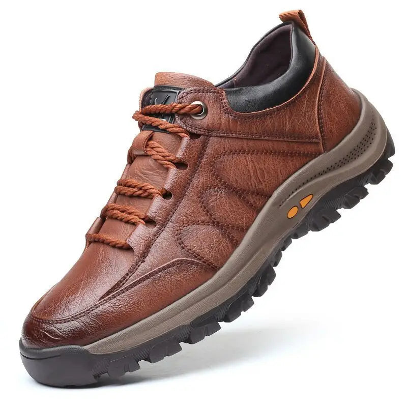 Men’s leather hiking shoes in brown leather with black accents and a textured sole designed for vintage casual footwear.