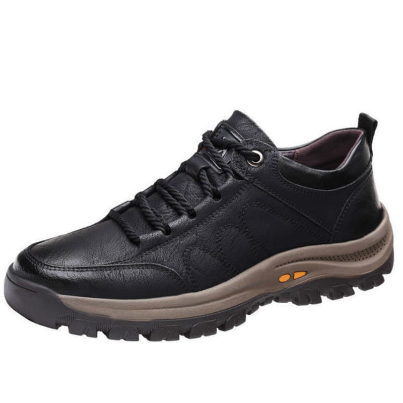 Men’s leather hiking shoe in black with rugged sole and orange accent details designed for vintage casual footwear.