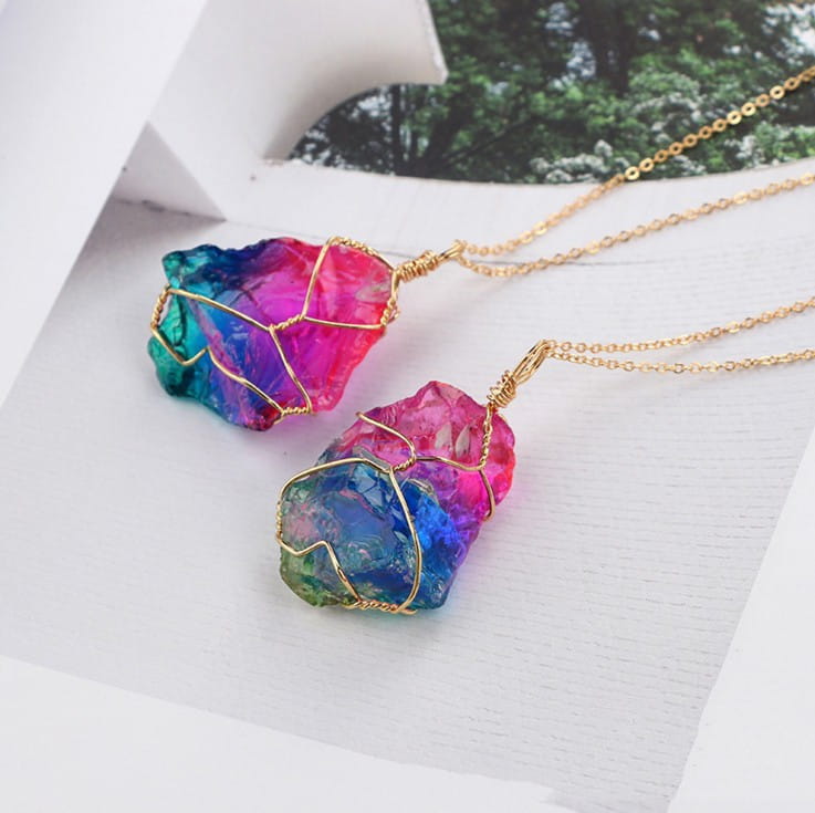 Vibrant rainbow quartz crystal pendant necklaces with gold wire wrapping and delicate chains.