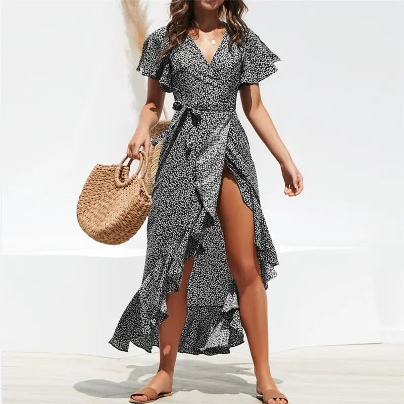 Black and white floral v neck chiffon maxi dress with ruffled sleeves and a high slit wrap design.